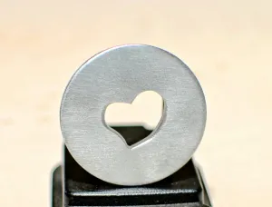 Golf ball marker with a heart cut out