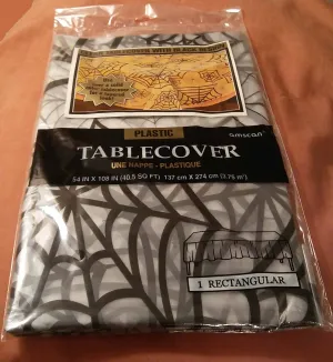 SPIDER WEB ON CLEAR TABLECLOTH
